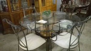 Dining table made of metal and glass, with chairs made of