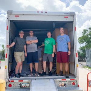 Houstonians delivering furniture to Houston Furniture Bank